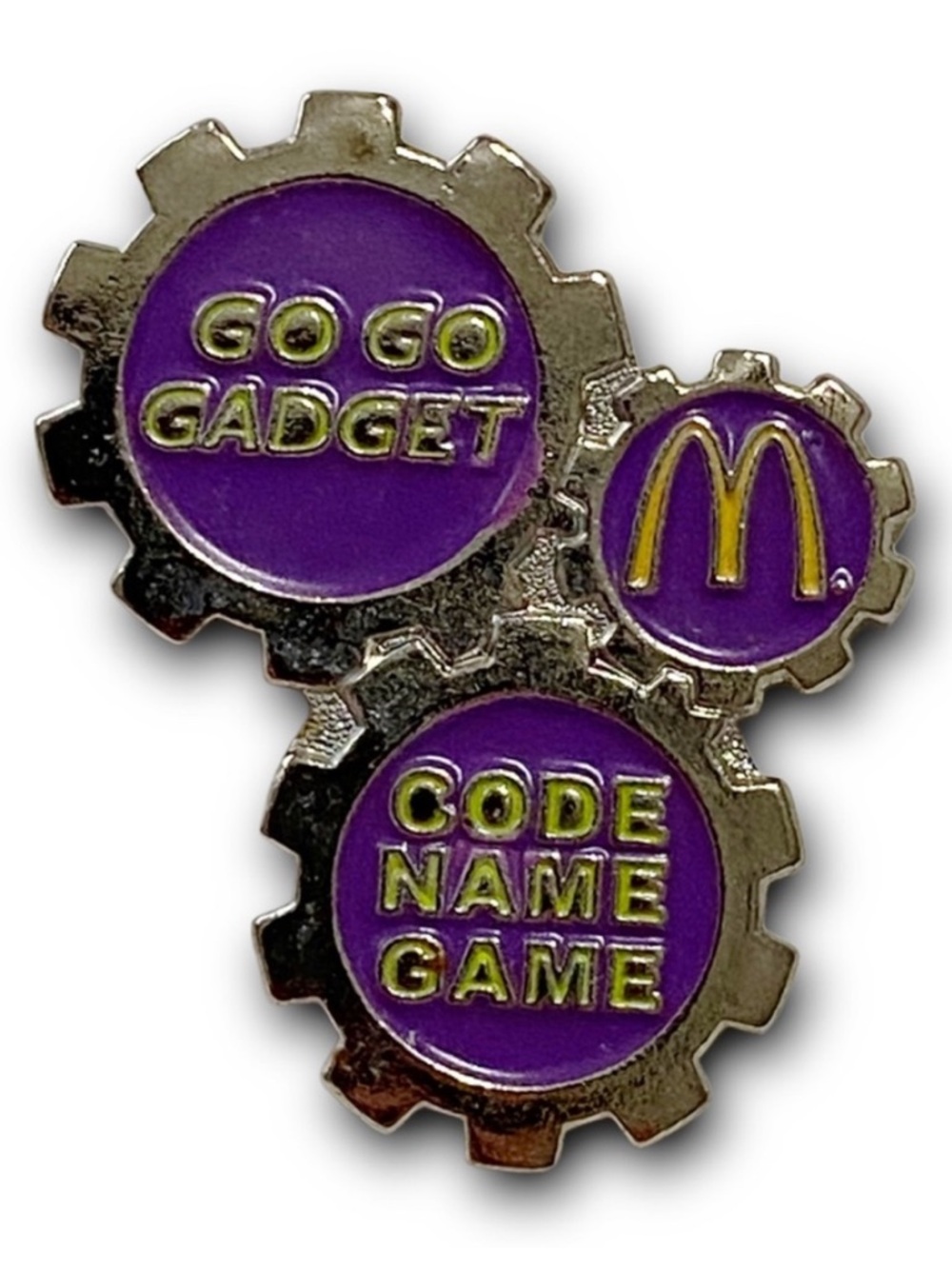 McDonald’s Pin Go Go Gadget 1999 Code Name Game Purple Gear Metal Lapel Pin